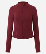 Campera deportiva Get Over en microfibra bordó, de ajuste próximo al cuerpo, con cuello alto, cierre frontal por cremallera y franja blanca contrastante desde los hombros hasta los puños.