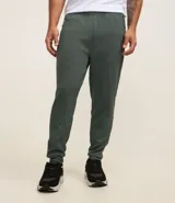 Pantalón deportivo de corte ajustado, confeccionado en tejido de poliéster texturizado color negro. Presenta cintura elástica con cordón de ajuste, bolsillos laterales con cierre y puños elásticos en los tobillos.