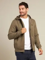 Canguro con capucha color ladrillo, con cierre frontal y bolsillos tipo canguro.