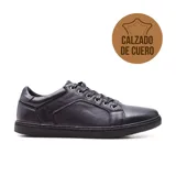 Zapato casual de cuero negro, con cordones y suela plana.