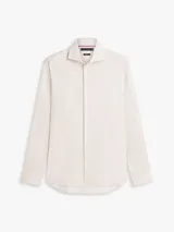 Camisa de manga larga Tommy Hilfiger con diseño de rayas beige y blancas, cuello con tecnología Flex y cierre frontal con botones.