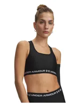 Top deportivo Under Armour modelo Crossback Mid, color negro, confeccionado en tejido HeatGear de doble capa con soporte estratégico para actividades de impacto medio. Cuenta con banda elástica inferior con el logotipo de la marca impreso en blanco.