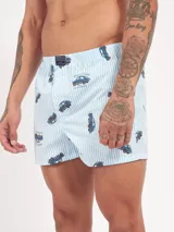 Bóxer de algodón blanco con estampado de flores pequeñas color celeste, con cintura elástica y logo de la marca en el centro.