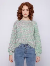 Sweater de tejido de punto multicolor en tonos verde, lila y blanco. Es de manga larga y corte holgado.