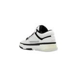 Championes Amiri MA-1 Low-Top en colores blanco y negro, con diseño de caña baja, paneles de malla y cuero, suela gruesa y cordones anchos.