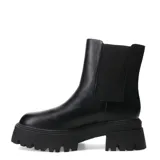 Botas altas de mujer color negro, estilo motociclista o 'biker', con suela track gruesa y plataforma. Presentan una caña alta que parece ser desmontable, con una tira ancha que rodea la parte inferior de la caña.