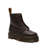 Botas de plataforma Dr. Martens modelo Sinclair, confeccionadas en cuero Crazy Horse color marrón oscuro con acabado desgastado. Presentan suela de goma estriada con costuras amarillas características, cierre frontal con cordones y cremallera central removible.