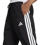 Pantalón de jogging negro Adidas Essentials, de corte clásico, con cintura elástica ajustable con cordón, bolsillos laterales, puños acanalados y logo de la marca estampado en blanco.