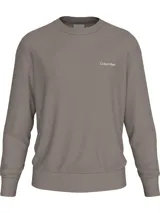 Buzo gris topo de algodón y poliéster con cuello redondo, puños y bajo de canalé. Logo de Calvin Klein bordado en el pecho.