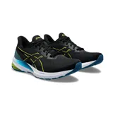 Championes de running Asics modelo GT-1000 12, color negro con detalles en amarillo fluor y celeste, entresuela blanca y suela azul.