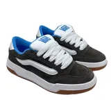 Championes Vans modelo Hylane, de diseño robusto en color marrón oscuro con detalles en blanco y azul. Presentan la icónica banda lateral de la marca en blanco, cordones gruesos, suela de plataforma blanca y base de goma color caramelo.