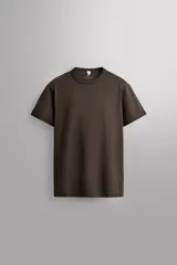 Camiseta relaxed fit de Zara Athleticz color beige, confeccionada en tejido compacto de algodón, con cuello redondo y manga corta.