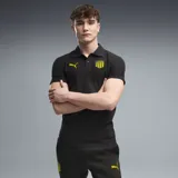 Chomba Puma del Club Atlético Peñarol, modelo CAP Polo, color negro con detalles en amarillo, cuello con botones y escudo del club y de la marca bordados.