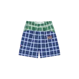 Short de baño Eme Studios modelo Gary Tartan, con diseño de paneles en cuadros tartán combinando verde en la parte superior y azul marino en la inferior. Cuenta con cintura elástica y parche con el logo de la marca en la pierna.