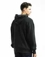 Buzo canguro negro con capucha, bolsillo frontal y corte oversized. Confeccionado en felpa de algodón y poliéster, con rib en puños y ruedo.