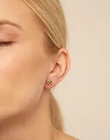 Aro piercing plateado con forma de ojo y cristal Swarovski color zafiro claro.