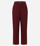 Pantalón de corte recto color bordó, confeccionado en tejido Orly con fondo melange. Presenta cintura con elástico en la parte posterior y cierre tradicional frontal.