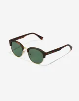 Lentes de sol Hawkers unisex, modelo Classic Rounded, con montura carey y lentes verdes polarizadas.