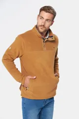 Buzo térmico de polar en color azul marino, con cuello alto y cierre frontal parcial mediante broches. Presenta bolsillos laterales con cierre y un bolsillo adicional con cierre en la manga izquierda.