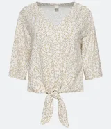 Blusa color crema con estampado animal print de jaguar en tonos dorados, escote en V, mangas 3/4 y nudo en la parte inferior.