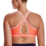 Top deportivo Under Armour color rosa con espalda cruzada y logo en la banda inferior.