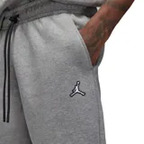 Pantalón de jogging Jordan Essential color gris melange, con cintura elástica ajustable mediante cordón, bolsillos laterales y puños elásticos en los tobillos. Presenta el logo Jumpman bordado en la parte superior izquierda.