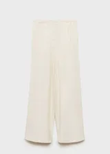 Pantalon wide leg de tiro medio, color beige, con cintura elástica y bolsillos laterales.