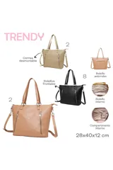 Bolso tipo shopper color beige con diseño estructurado, logo 'TRENDY' grabado en el frente y dos bolsillos verticales con cierre metálico. Incluye doble asa de mano y correa larga ajustable y extraíble.