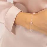 Pulsera de plata 925 con cadena de eslabones y cinco dijes circulares de cuarzo rosado.