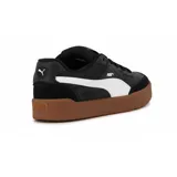 Championes Puma Park Sk8 negros con detalles en blanco y suela color caramelo.