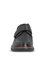 Zapatos de cuero negro Hush Puppies modelo Iowa, con cierre de tira de velcro en el empeine, costuras visibles en la suela y suela de goma EVA.