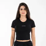Remera corta negra de algodón y elastano, con cuello redondo y estampado frontal con la palabra 'GAINS' en color blanco.