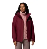 Campera 3 en 1 Columbia con sistema Interchange, compuesta por una capa exterior impermeable con tecnología Omni-Tech y una capa interior de forro polar con tecnología termorreflectante Omni-Heat. Presenta capucha desmontable, cierre frontal con solapa, bolsillos laterales con cremallera y puños ajustables.