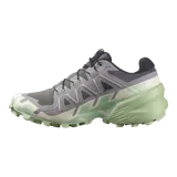 Calzado de trekking Salomon modelo Speedcross 6, en tonos gris y verde claro, diseñadas para trail running con suela de gran tracción y cordones de ajuste rápido.