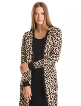 Vestido de tejido de punto marca Nina Leonard, con diseño Twofold que simula un conjunto de vestido negro liso y cárdigan largo con estampado geométrico blanco y negro. Presenta escote redondo y manga larga de corte recto.