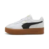 Championes Puma Palermo Elevata, color blanco con franja lateral negra y suela marrón.