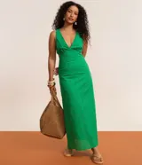 Vestido midi verde de algodón con escote en V, recortes laterales en la cintura y diseño sin mangas.