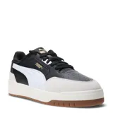 Championes Puma modelo Shuffle Downtown, con diseño urbano de inspiración retro. Presentan una combinación de cuero negro y gamuza en tono crema, con la icónica franja lateral de Puma en blanco. Cuentan con suela de goma color caramelo y entresuela blanca, ofreciendo un estilo versátil y cómodo.