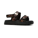 Sandalias bajas Balizza con plataforma de goma negra y tiras con estampado animal print.