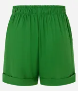 Short color verde esmeralda confeccionado en tejido de lino y viscosa, con cintura elástica, cierre tradicional y bajo plegado.