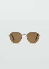 Gafas de sol con montura metálica dorada y diseño redondo, con lentes de tono marrón.