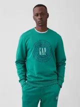 Buzo deportivo Gap de cuello redondo y manga larga, color verde esmeralda, con estampa circular en el pecho que incluye el logo de la marca.