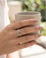 Anillo de plata 925 con diseño calado geométrico en forma de rombos entrelazados.