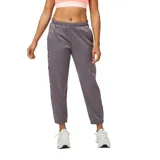 Pantalón de jogging gris con tecnología NB HEAT, corte deportivo y logo New Balance a lo largo de la pierna.