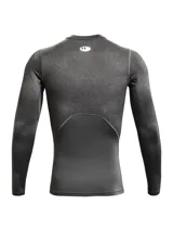 Remera térmica de compresión Under Armour de manga larga, confeccionada en tejido HeatGear ultraligero con paneles de malla estratégicos para ventilación. Presenta diseño ergonómico con mangas raglán y logo de la marca en el pecho.