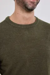 Sweater de tejido de punto color naranja melange, con cuello redondo y manga larga.