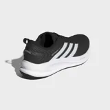 Championes de running Adidas modelo Supernova Ease 2, color negro con detalles en blanco. Presentan empeine de malla técnica ligera, mediasuela Dreamstrike para una amortiguación blanda y estable, y suela de goma con tracción dinámica.