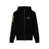 Buzo con capucha y cierre frontal de la marca EA7 Emporio Armani. Presenta un diseño en color negro con detalles estampados en color dorado, incluyendo el logo en el pecho y el nombre de la marca en la manga derecha. Cuenta con bolsillos tipo canguro y cordones ajustables en la capucha.