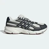 Championes Adidas Technocaos 2000 de estilo retro inspirado en los años 2000. Presentan un diseño con base de malla transpirable y superposiciones sintéticas en tonos oscuros, con las icónicas tres tiras laterales. Incorporan mediasuela con tecnología Cloudfoam para mayor amortiguación y suela de goma esculpida.