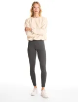 Legging de tiro alto confeccionada en algodón elástico con cintura ancha modeladora. Presenta un calce ajustado y tejido opaco de tacto natural.